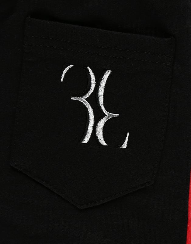 The brand's monogram is the defining feature of these cotton fleece sweatpants. It is embroidered on the right rear pocket. Contrasting sidebands are printed on both legs. Two slit pockets on the front and one on the back. Ribbed waistband and bottom cuffs.