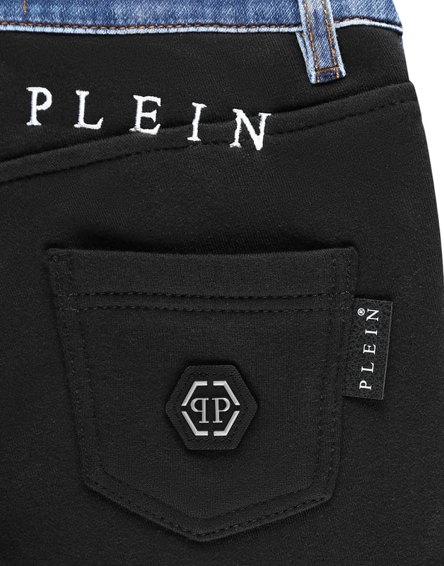 Stone washed denim 5 pocket pants with topstitched seams and placed embroideries. The rear side is made of cotton fleece. The iconic saffian leather PP Hexagonal is sewn over the right rear pocket. Single metal button at waist. Ribbed bottom cuffs. Fit: Jogging.