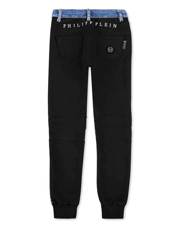Stone washed denim 5 pocket pants with topstitched seams and placed embroideries. The rear side is made of cotton fleece. The iconic saffian leather PP Hexagonal is sewn over the right rear pocket. Single metal button at waist. Ribbed bottom cuffs. Fit: Jogging.