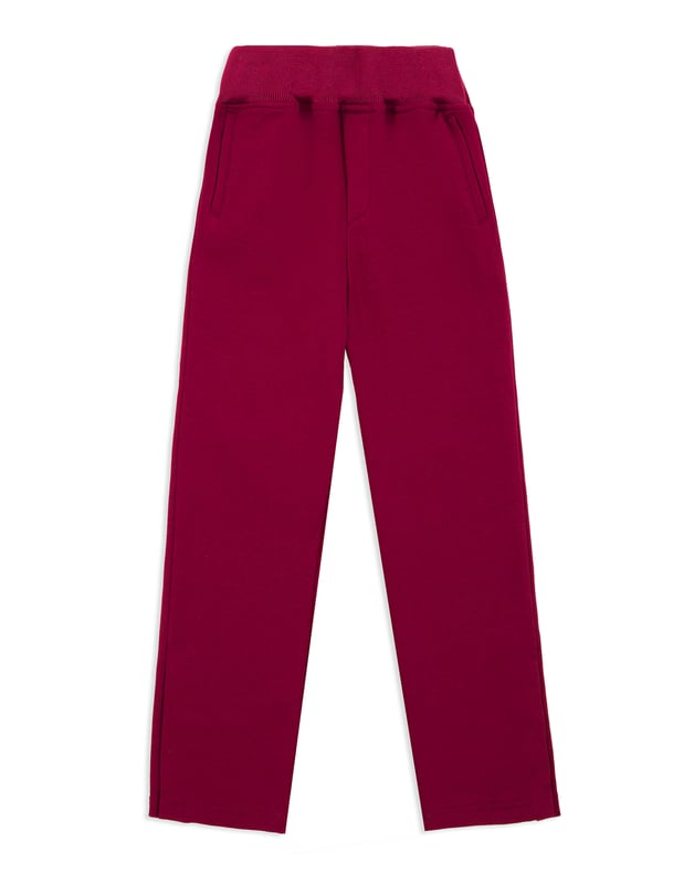 Cotton jersey jogging trousers. Two pockets. Embroidered crest at the back right pocket. Ribbed waistband with drawstring. Snap buttons at bottom.