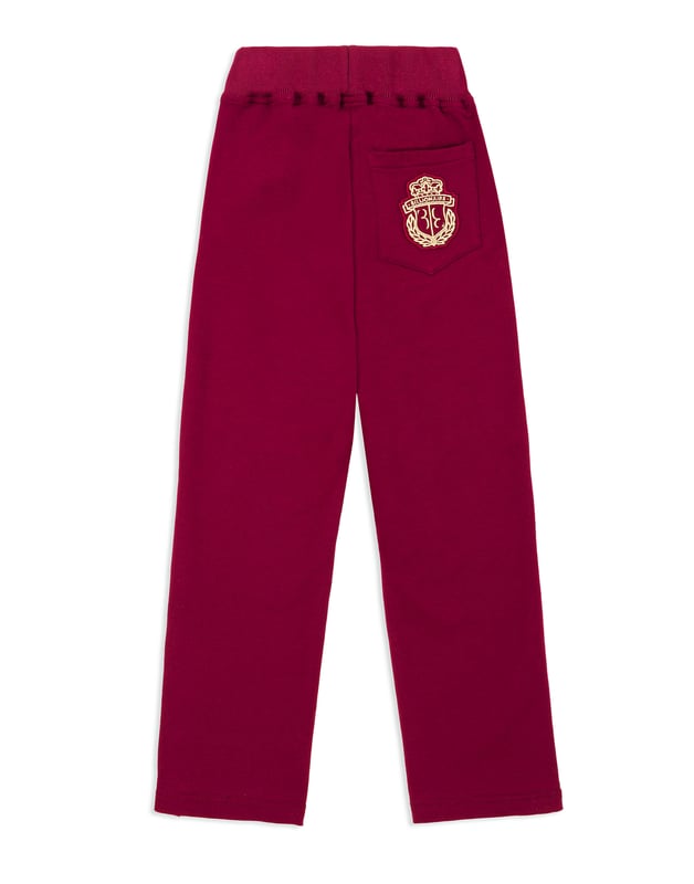 Cotton jersey jogging trousers. Two pockets. Embroidered crest at the back right pocket. Ribbed waistband with drawstring. Snap buttons at bottom.