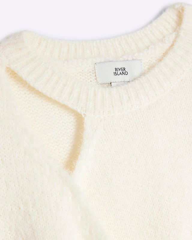 Crew neck, Cut out detail, Button fastening, Long sleeved