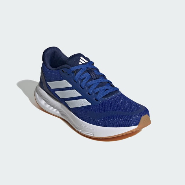 Runfalcon 5 Shoes Kids Run, play, repeat — these juniors' adidas sneakers support you on the go. Low-key retro styling meets modern comfort in a shoe designed for adventurous spirits. A Cloudfoam midsole puts a spring in your step while the textile upper feels cool and comfortable. Classic laces provide a secure fit so you can go ahead and push your limits.This product features at least 20% recycled materials. By reusing materials that have already been created, adidas help to reduce waste and our reliance on finite resources and reduce the footprint of the products adidas make. - Regular fit - Lace closure - Textile upper - Textile lining - Cloudfoam midsole - Rubber outsole - Contains at least 20% recycled content Shipped by adidas
