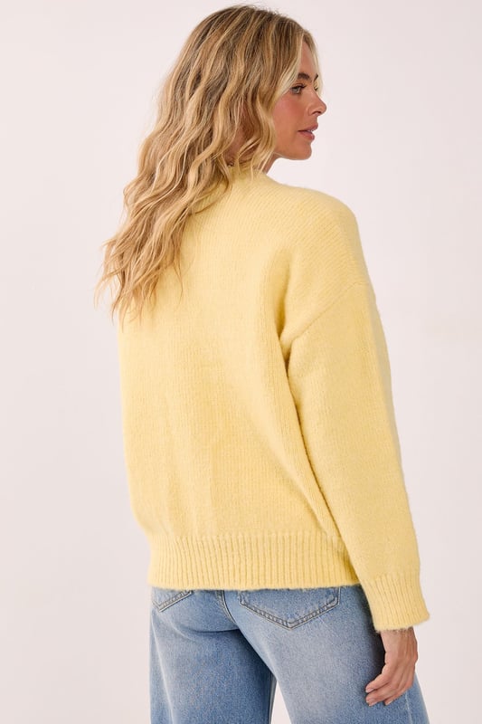 Cosy turtleneck design for ultimate comfort
        Oversized fit with voluminous balloon sleeves
        Ribbed cuffs and hem for a snug finish
        Soft knitted texture for a luxurious feel
        Versatile piece suitable for various casual occasions
    
    Embrace the chilly season with this NastyGal turtleneck sweater, a must-have addition to your autumn-winter wardrobe. The oversized silhouette paired with dramatic balloon sleeves creates a striking visual impact, perfect for those who love to make a statement with their casual wear. Style this jumper with a mini skirt and knee-high boots for a trendy contrast, as seen on our model. For a more laid-back look, pair it with your favourite jeans and trainers. The versatility of this piece makes it ideal for various casual settings, from coffee dates to family gatherings. Layer it over a collared shirt for a preppy twist, or wear it on its own for a sleek, minimalist approach. This turtleneck sweater is your go-to for effortless style and warmth throughout the cooler months.