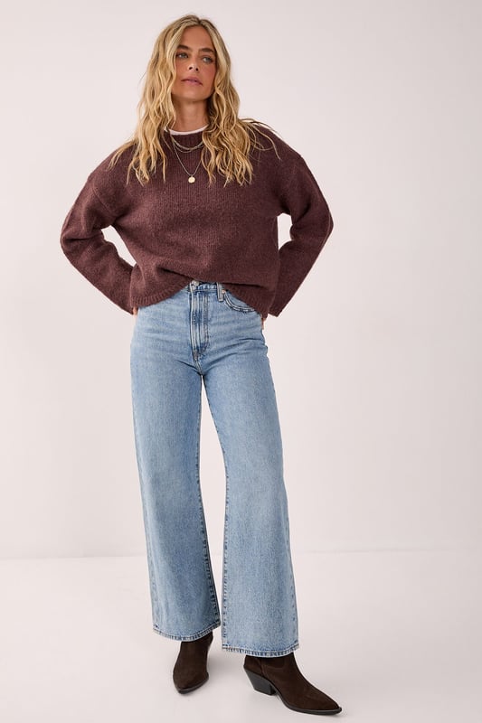Oversized fit for ultimate comfort and style
        Crew neck design for a classic look
        Ribbed cuffs and hem for a snug fit
        Dropped shoulders for a relaxed silhouette
        Versatile knitted texture suitable for various occasions
    
    This NastyGal Oversized Crew Neck Sweater is the epitome of casual chic. The roomy fit and soft knitted fabric combine to create a garment that's both comfortable and stylish. Perfect for those laid-back days when you want to look effortlessly cool, this sweater can be dressed up or down with ease. Layer it over a crisp white shirt for a preppy twist, or pair it with your favourite jeans and trainers for a classic weekend look. The versatile design makes it ideal for family gatherings, coffee dates with friends, or even casual Fridays at the office. For a trendy contrast, try wearing it with a delicate lace skirt and chunky boots, as shown in the image. Add some statement jewellery to complete your ensemble and you'll be ready to tackle any casual event with confidence and flair.