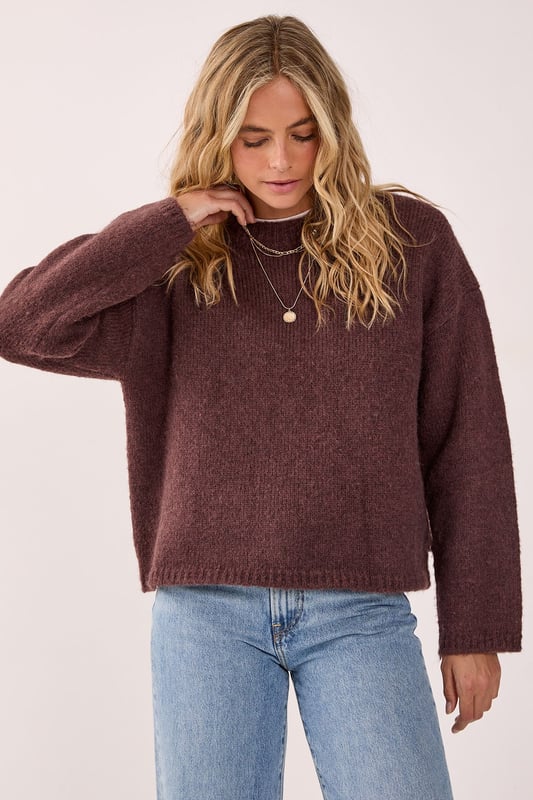 Oversized fit for ultimate comfort and style
        Crew neck design for a classic look
        Ribbed cuffs and hem for a snug fit
        Dropped shoulders for a relaxed silhouette
        Versatile knitted texture suitable for various occasions
    
    This NastyGal Oversized Crew Neck Sweater is the epitome of casual chic. The roomy fit and soft knitted fabric combine to create a garment that's both comfortable and stylish. Perfect for those laid-back days when you want to look effortlessly cool, this sweater can be dressed up or down with ease. Layer it over a crisp white shirt for a preppy twist, or pair it with your favourite jeans and trainers for a classic weekend look. The versatile design makes it ideal for family gatherings, coffee dates with friends, or even casual Fridays at the office. For a trendy contrast, try wearing it with a delicate lace skirt and chunky boots, as shown in the image. Add some statement jewellery to complete your ensemble and you'll be ready to tackle any casual event with confidence and flair.