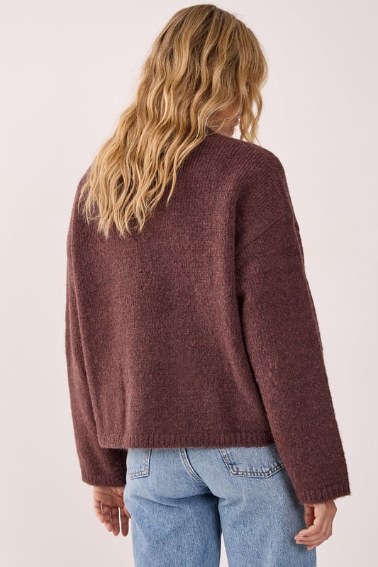 Oversized fit for ultimate comfort and style
        Crew neck design for a classic look
        Ribbed cuffs and hem for a snug fit
        Dropped shoulders for a relaxed silhouette
        Versatile knitted texture suitable for various occasions
    
    This NastyGal Oversized Crew Neck Sweater is the epitome of casual chic. The roomy fit and soft knitted fabric combine to create a garment that's both comfortable and stylish. Perfect for those laid-back days when you want to look effortlessly cool, this sweater can be dressed up or down with ease. Layer it over a crisp white shirt for a preppy twist, or pair it with your favourite jeans and trainers for a classic weekend look. The versatile design makes it ideal for family gatherings, coffee dates with friends, or even casual Fridays at the office. For a trendy contrast, try wearing it with a delicate lace skirt and chunky boots, as shown in the image. Add some statement jewellery to complete your ensemble and you'll be ready to tackle any casual event with confidence and flair.