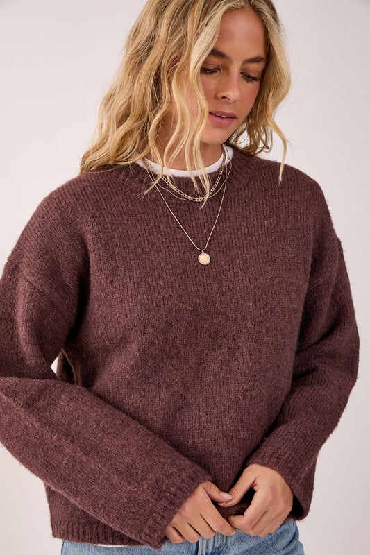 Oversized fit for ultimate comfort and style
        Crew neck design for a classic look
        Ribbed cuffs and hem for a snug fit
        Dropped shoulders for a relaxed silhouette
        Versatile knitted texture suitable for various occasions
    
    This NastyGal Oversized Crew Neck Sweater is the epitome of casual chic. The roomy fit and soft knitted fabric combine to create a garment that's both comfortable and stylish. Perfect for those laid-back days when you want to look effortlessly cool, this sweater can be dressed up or down with ease. Layer it over a crisp white shirt for a preppy twist, or pair it with your favourite jeans and trainers for a classic weekend look. The versatile design makes it ideal for family gatherings, coffee dates with friends, or even casual Fridays at the office. For a trendy contrast, try wearing it with a delicate lace skirt and chunky boots, as shown in the image. Add some statement jewellery to complete your ensemble and you'll be ready to tackle any casual event with confidence and flair.