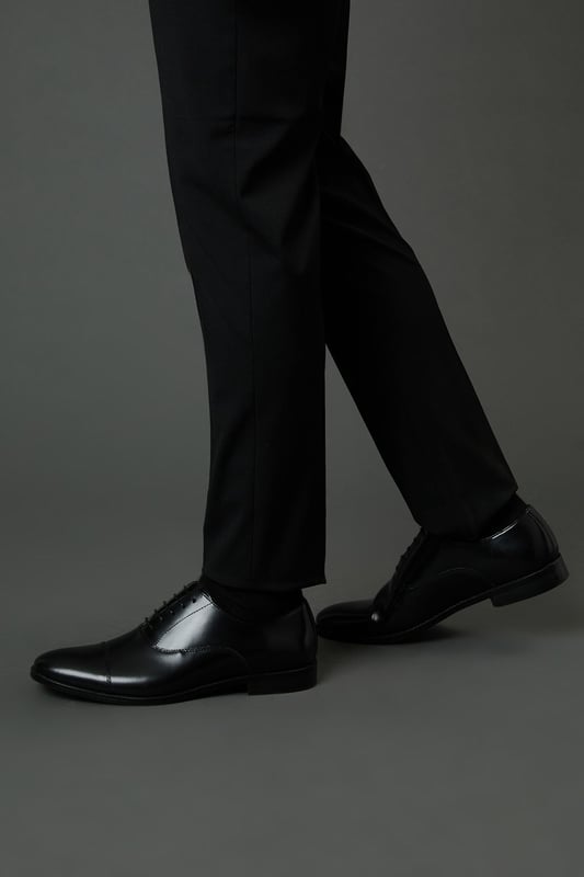 Classic Oxford design with traditional toe cap detailing
        High shine genuine leather upper for a sophisticated finish
        Traditional lace-up fastening with five eyelets for secure fit
        Sleek silhouette with minimal stitching for a clean, refined look
        Versatile design suitable for both formal occasions and smart-casual settings
    
    These timeless Oxford shoes from Burton combine classic British styling with everyday versatility. The high shine leather construction creates a polished appearance that works effortlessly with formal attire, while remaining understated enough for more relaxed occasions. Pair with tailored trousers as shown for business meetings or important events, or style with dark denim for smart pub lunches with mates. The traditional toe cap and clean lines reflect a heritage-inspired aesthetic that never goes out of fashion. Comfortable enough for all-day wear at the office, yet smart enough for special occasions, these Oxfords represent the perfect balance of practicality and style. Their durable construction ensures they'll remain a wardrobe staple for years to come - simply buff regularly to maintain their distinguished shine.
