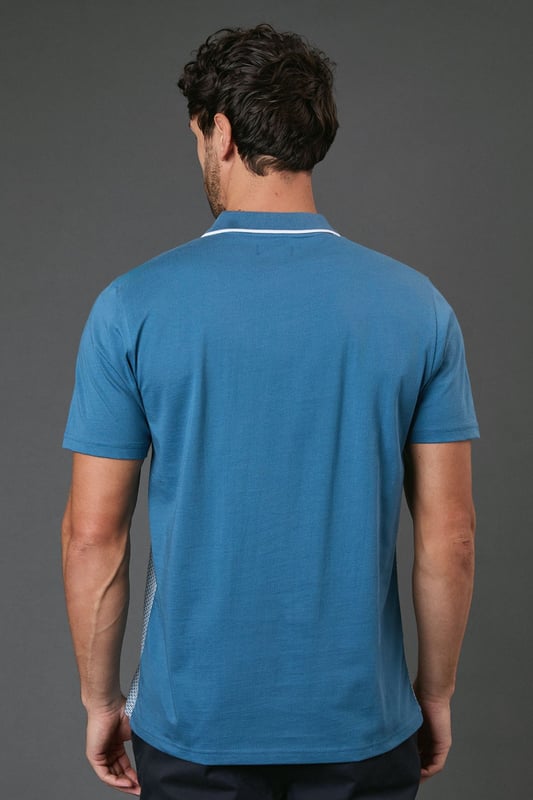 Distinctive jacquard pattern across the front body for a textured appearance
        Quarter-zip neckline with contrast tipping for a sporty finish
        Contrast solid sleeves creating a modern colour-block effect
        Ribbed collar with contrast trim for a refined touch
        Comfortable cotton fabric ideal for all-day wear
    
    This Burton jacquard polo offers a contemporary twist on a classic style. The textured pattern across the front creates visual interest whilst maintaining a sophisticated look that works perfectly for various casual occasions. Style it as shown with dark trousers and white trainers for an effortlessly smart weekend outfit, or pair with your favourite jeans for a relaxed pub lunch with mates. The quarter-zip detail adds functionality and a sporty element that nods to active lifestyles without compromising on style. Perfect for summer barbecues, casual Fridays at the office, or watching the match with friends. The contrast sleeves and collar detailing provide just enough interest to stand out from standard polos in your wardrobe, whilst the cotton construction ensures breathability and comfort throughout the day. A versatile addition to any casual wardrobe that bridges the gap between laid-back and put-together.