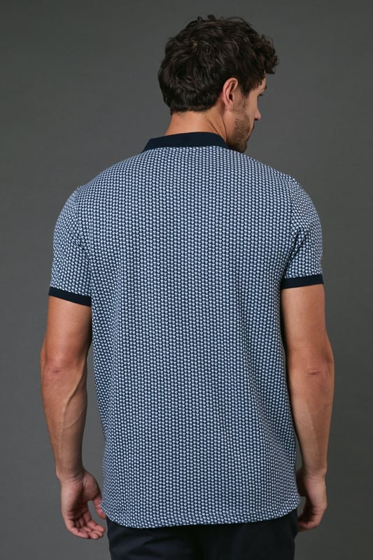 Distinctive abstract geometric pattern throughout for a modern twist on classic polo styling
        Contrast collar and sleeve cuffs add refined detailing to the design
        Three-button placket for adjustable neckline comfort
        Soft cotton fabric ensures breathability and all-day comfort
        Regular fit silhouette offers ease of movement without sacrificing style
    
    This Burton abstract geo polo shirt combines timeless appeal with contemporary pattern work, making it a versatile addition to your casual wardrobe. The contrast collar and cuffs create a smart finish that works brilliantly when paired with dark trousers as shown, or with your favourite chinos for weekend outings. Perfect for casual gatherings at the pub with mates or family barbecues, this polo offers that sweet spot between relaxed and put-together. For a complete look, team with dark jeans or chinos and clean white trainers - ideal for those occasions when you want to look effortlessly stylish without appearing overdressed. The breathable cotton construction ensures comfort throughout the day, whether you're watching the match or enjoying a casual lunch out. Machine washable at 30 degrees, this polo maintains its shape and pattern with proper care.
