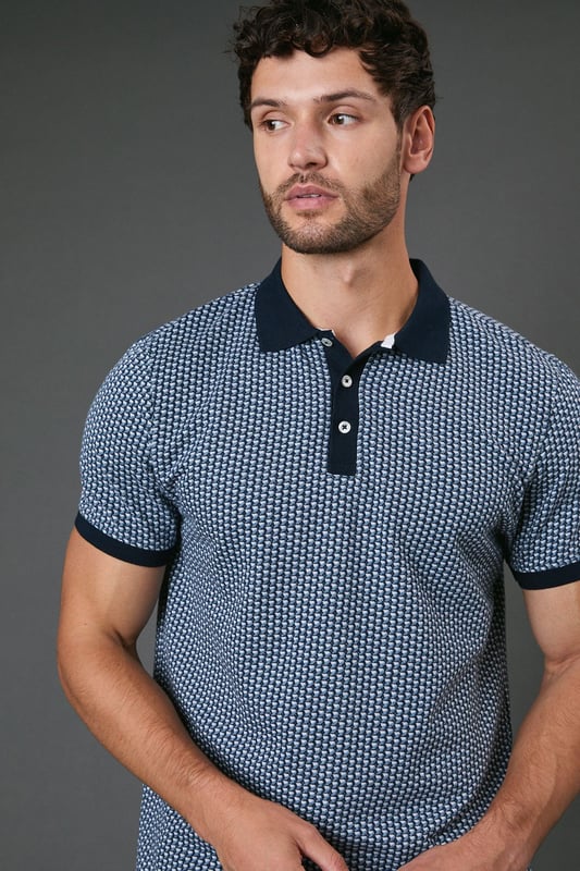 Distinctive abstract geometric pattern throughout for a modern twist on classic polo styling
        Contrast collar and sleeve cuffs add refined detailing to the design
        Three-button placket for adjustable neckline comfort
        Soft cotton fabric ensures breathability and all-day comfort
        Regular fit silhouette offers ease of movement without sacrificing style
    
    This Burton abstract geo polo shirt combines timeless appeal with contemporary pattern work, making it a versatile addition to your casual wardrobe. The contrast collar and cuffs create a smart finish that works brilliantly when paired with dark trousers as shown, or with your favourite chinos for weekend outings. Perfect for casual gatherings at the pub with mates or family barbecues, this polo offers that sweet spot between relaxed and put-together. For a complete look, team with dark jeans or chinos and clean white trainers - ideal for those occasions when you want to look effortlessly stylish without appearing overdressed. The breathable cotton construction ensures comfort throughout the day, whether you're watching the match or enjoying a casual lunch out. Machine washable at 30 degrees, this polo maintains its shape and pattern with proper care.