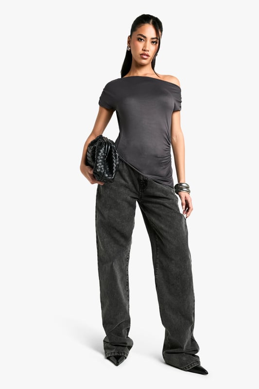 Off-shoulder design for a chic, contemporary look
        Soft, figure-hugging fabric that drapes beautifully
        Ruched detailing adds texture and interest
        Short sleeves for versatile wear
        Asymmetrical neckline creates a unique silhouette
    
    This super-soft off-shoulder top from Boohoo is the epitome of effortless style. The ruched detailing and figure-hugging fit create a flattering silhouette that's perfect for a variety of occasions. Pair it with wide-leg trousers and statement jewellery for a trendy daytime look, or dress it up with a sleek midi skirt and heels for evening drinks. The versatile design allows for easy transition from casual brunches to more upscale events. The asymmetrical neckline adds a touch of drama, making this top a standout piece in any wardrobe. Ideal for the fashion-forward woman who values both comfort and style, this top is a must-have for those who want to stay on-trend without compromising on wearability.