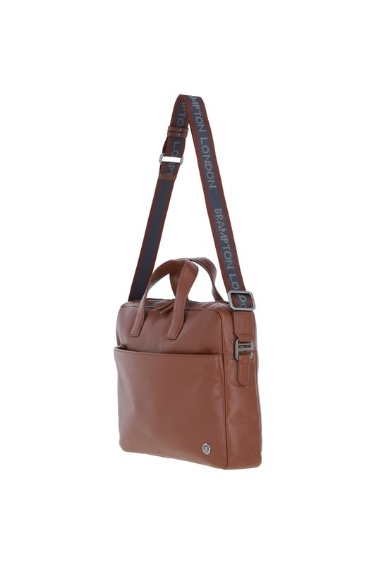 The Brampton Leather Laptop Bag combines style and functionality, crafted from 100% genuine leather for modern professionals. It features a padded laptop compartment, two external zip pockets, an external slip-in pocket, seven internal slip-in pockets, and an internal zip pocket for valuables. Equipped with a sturdy top handle and adjustable shoulder strap, this sleek and durable bag is perfect for commuting and business travel, gaining character with use. Dimensions: (L) 39.5 cm x (H) 30 cm x (W) 8.5 cm, with a strap length of 63.5 cm (longest) and 36 cm (shortest).