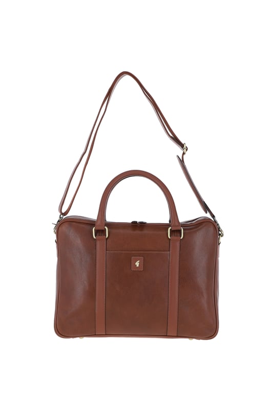 This Gabicci, genuine premium leather laptop messenger bag is sleek and sophisticated, with today’s professional in mind, fully lined with Gabicci’s signature paisley lining, beautifully crafted in a luxury, premium heavy grain leather with a smooth trim, a laptop work bag that is contemporary, fashionable, and organised for any occasion. Amazing travel bag for men. Thoughtfully designed, beautifully crafted, featuring a secure padded 15” laptop compartment, quick access front slip pocket, ideal for your smartphone, a well organised and roomy interior, great for carrying all your documents/paperwork, spacious internal zip pocket ideal for travel documents wallets and keys, this leather laptop bag keeps it all safely organised. Quick grip, smooth, short leather carry handles and a detachable and adjustable shoulder strap, for a more comfortable, secure, hands-free cross body commute.
A luxury Mens Laptop Messenger Bag promises unrelenting high quality, giving you a piece that will last for years. We have expertise and commitment to sourcing only the best leathers as a company. Since 1973, Gabicci has played a huge part in music and youth culture, proudly worn by many celebrities. The definitive Gabicci look combines Italian inspired styling with a nod to 50’s rock, brought to the UK by Gabicci founders after a brief vacation to the Italian seaside town of Gabicci Mare. Dimensions: (L) 40 cm x (W) 7 cm x (H) 30 cm.