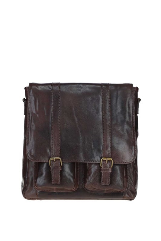This premium leather messenger bag features brass hardware, a spacious main compartment, two front buckle pockets, and a back zip pocket for easy access. Inside, it offers two pockets and a compartment for organisation, along with an adjustable shoulder strap and fully lined branded interior. Dimensions: (L) 32 cm x (W) 11 cm x (H) 33 cm.