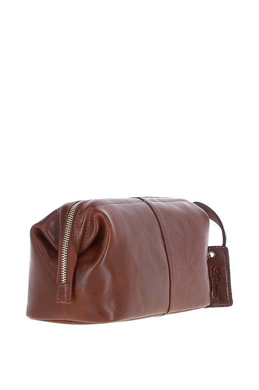Crafted from rugged, full-grain leather, this vintage-style washbag features a spacious main compartment with a zip closure, 1 outer zip pocket for easy-access items, and 3 internal pockets to keep toiletries neatly organized. Its distressed finish adds a timeless, masculine edge, while gold-coloured hardware enhances the classic design. Dimensions: 26 cm (L) x 12 cm (W) x 13 cm (H).