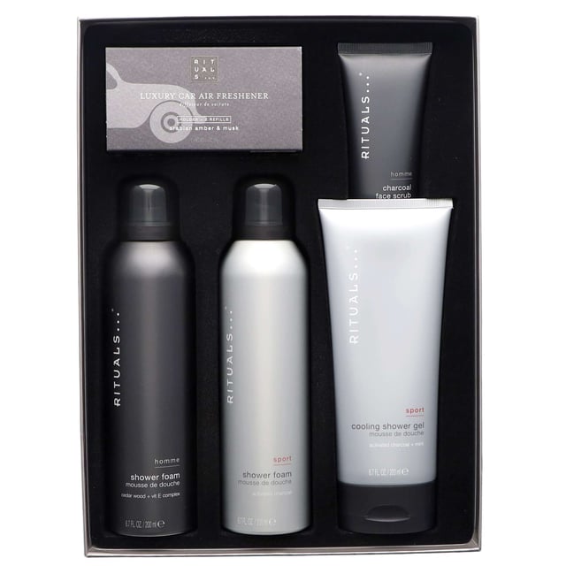 Discover the Rituals Homme Large Gift Set, a perfect grooming collection designed for the modern man. This luxurious set includes:

- Rituals Homme Shower Foam (200ml)
- Rituals Homme Sport Shower Foam (200ml)
- Rituals Homme Sport Cooling Shower Gel (200ml)
- Rituals Homme Charcoal Face Scrub (70ml)
- Rituals Homme Car Air Freshener (2 x 3g)

Transform your shower routine with rich foams infused with amber and musk, deeply nourishing your skin. The cooling shower gel purifies with activated charcoal, while the face scrub revitalizes and exfoliates. Complete the experience with a sophisticated car air freshener that offers a distinctly masculine scent. Ideal for gifting or personal indulgence, elevate your daily routine with this essential grooming set.