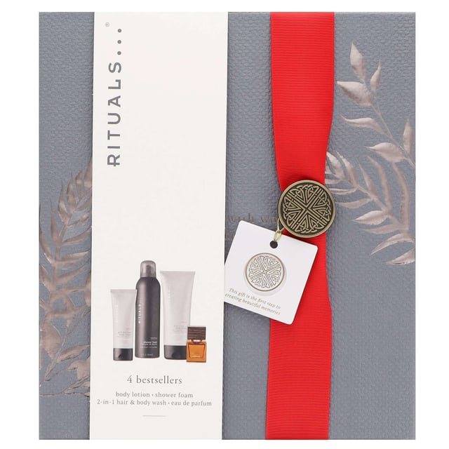 Discover the Rituals Homme Medium Gift Set, a luxurious collection designed for the modern man. This set includes: 200ml Rituals Homme Foaming Shower Gel for a refreshing cleanse, 200ml Rituals Homme 2 in 1 Shampoo & Body Wash for a revitalising wash, 70ml Rituals Sport Anti-Dryness Lotion to combat dry skin, and 15ml Rituals Homme L'Essentiel Eau de Parfum Spray with a captivating blend of cardamom, patchouli, and sandalwood. Perfect for daily use or as a thoughtful gift.