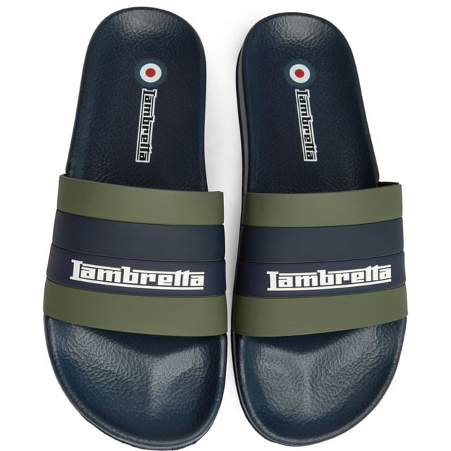 The Lambretta Prince slides bring effortless Italian style to your summer rotation. Crafted entirely in rubber with a vibrant green finish, these men's sandals feature comfortable insoles that make them perfect for poolside lounging or casual street wear. The iconic Lambretta branding adds a touch of heritage cool to this laid-back essential that transitions seamlessly from beach to city.