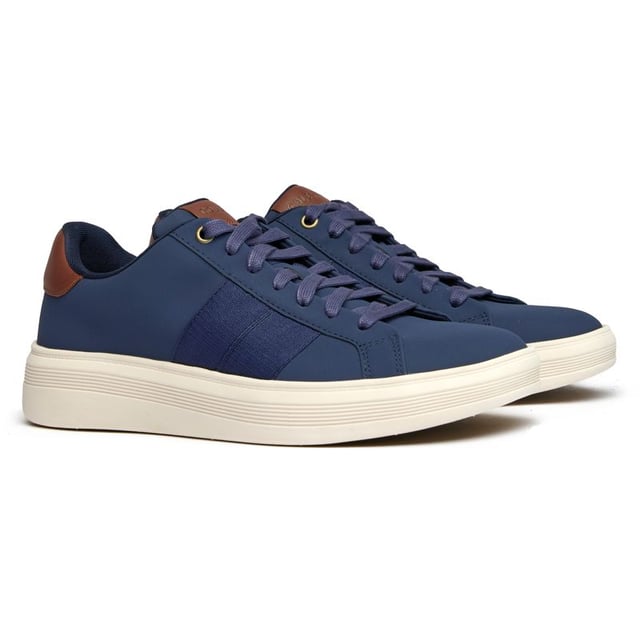 Zapatillas Cole Haan Grand Crosscourt Premier azules para hombre, fabricadas en piel y suela de goma. Incluyen: plantilla ligera y acolchada, logo de Cole Haan y suela Grand 360.