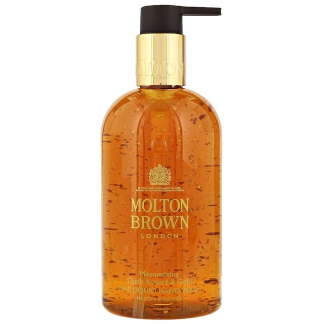 Molton Brown Mesmerising Oudh Accord & Gold Hand Wash - 300ml Indulge in the luxurious Molton Brown Mesmerising Oudh Accord & Gold Hand Wash, specially formulated to cleanse and nourish your skin. Infused with a captivating blend of cinnamon leaf, nutmeg, bergamot, elemi, myrrh, black tea, oudh, vetiver, and honey, this hand wash offers a rich sensory experience. Suitable for all skin types, it is also cruelty-free, certified by Leaping Bunny. Elevate your hand washing routine with this exquisite 300ml hand wash from Molton Brown, perfect for daily use or as a thoughtful gift.