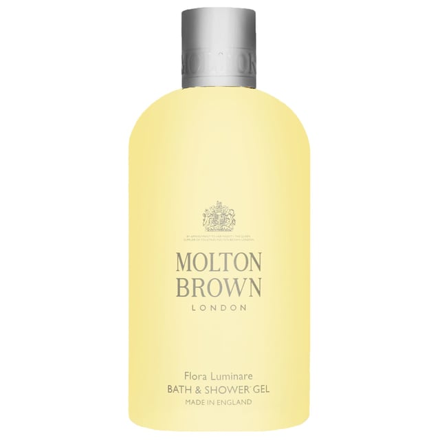 Experience the luxury of Molton Brown Flora Luminare Bath & Shower Gel, a rejuvenating body wash infused with a vibrant floral scent that transports you to tropical paradises. This exquisite gel features a creamy blend of bitter almond and crisp mandarin, harmonized with aromatic olibanum and petitgrain. The heart reveals lush notes of tiare absolute, neroli, jasmine, and rose absolute, while the earthy base of mate, sandalwood, cedar, and musk grounds this luxurious experience. Enjoy a cruelty-free cleansing ritual with Molton Brown, a Leaping Bunny approved brand.