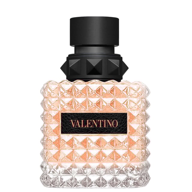 Experience the enchanting allure of Valentino Donna Born In Roma Coral Fantasy Eau de Parfum. This exquisite fragrance captures the essence of a Roman sunset with vibrant notes. The top note features a refreshing kiwi accord blended with sparkling orange for a bold introduction. At its heart, a luxurious infusion of jasmine flowers creates a modern floral bouquet. Finally, the warm base note of ambrette seeds adds a soft, textured finish. Housed in a stunning coral bottle inspired by Rome's twilight, this 50ml perfume is a must-have for every woman.