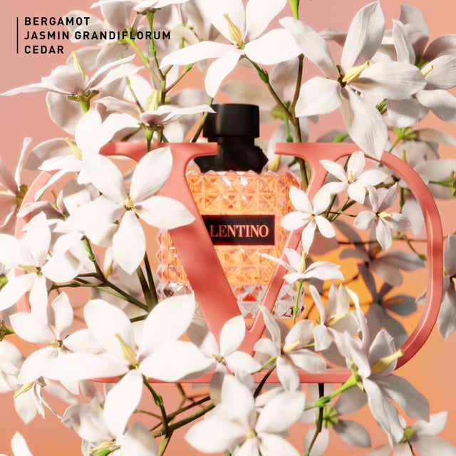 Experience the enchanting allure of Valentino Donna Born In Roma Coral Fantasy Eau de Parfum. This exquisite fragrance captures the essence of a Roman sunset with vibrant notes. The top note features a refreshing kiwi accord blended with sparkling orange for a bold introduction. At its heart, a luxurious infusion of jasmine flowers creates a modern floral bouquet. Finally, the warm base note of ambrette seeds adds a soft, textured finish. Housed in a stunning coral bottle inspired by Rome's twilight, this 50ml perfume is a must-have for every woman.