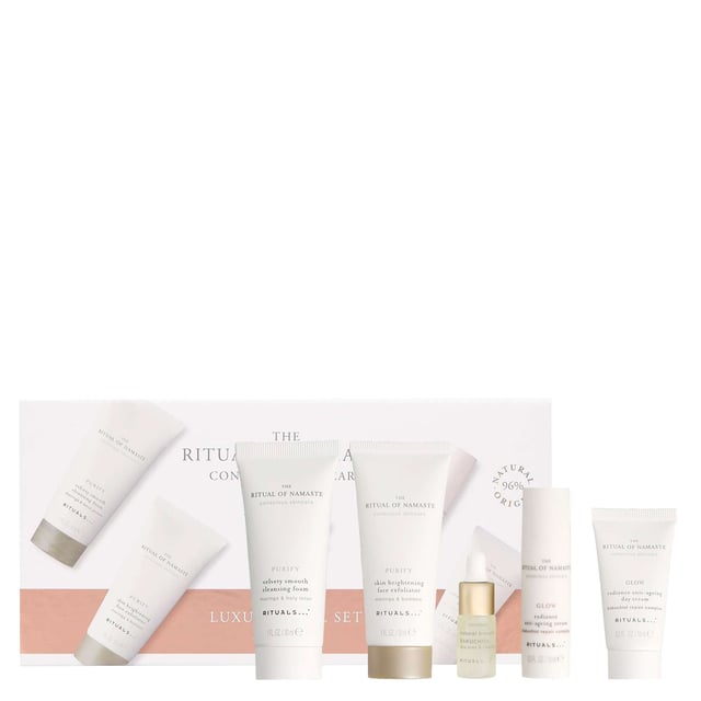 Discover the Rituals The Ritual of Namaste Luxury Skincare Trial Set, featuring over 93% natural ingredients and plant-based alternatives to retinol. This luxurious set includes: 30ml Skin Brightening Face Exfoliator, 10ml Glow Serum, 4ml Natural Booster Bakuchiol, 10ml Glow Day Cream, and 30ml Velvety Smooth Cleansing Foam. Each product is designed to enhance your skin's radiance and vitality. Perfect for your daily skincare routine, these products cleanse, exfoliate, and nourish your skin, leaving it soft, smooth, and rejuvenated. Ideal for women seeking a natural skincare solution.