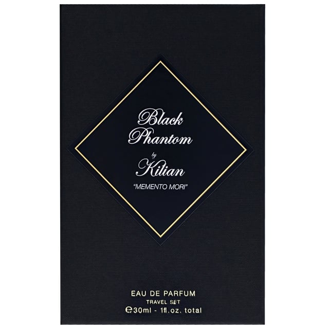 Discover the Kilian Black Phantom "Memento Mori" Eau de Parfum Travel Set, a captivating collection featuring four 7.5ml bottles of this enchanting fragrance. This dark and mysterious scent unveils ethereal amber notes, enriched with warm spices and a delightful sweetness. Experience the luxurious blend of rich vanilla, dark chocolate, rum, caramel, and coffee, perfectly balanced with a touch of sugar and enhanced by sandalwood, heliotrope, and almond for a savory richness. Ideal for on-the-go elegance, this set includes a stylish Kilian Travel Atomiser.
