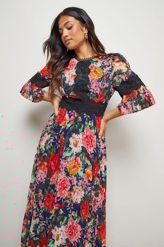 Elegant midi dress featuring delicate lace trim detailing across the bodice
        Feminine pleated skirt creates beautiful movement and dimension
        Flattering crew neckline complemented by charming three-quarter length sleeves
        Designed specifically for petite frames with a perfectly proportioned midi length
        Striking printed pattern throughout adds visual interest and contemporary appeal
    
    This enchanting Oasis midi dress combines classic femininity with modern design elements. The intricate lace trim adds a touch of romance to the bodice, whilst the pleated skirt creates a graceful silhouette that moves beautifully with every step. Perfect for special occasions, this dress can be styled with strappy heels and a clutch bag for weddings or formal events. The versatile design also transitions wonderfully to garden parties or race day events when paired with a fascinator and elegant jewellery. The three-quarter length sleeves offer just the right amount of coverage, making this piece suitable for various seasons. For cooler evenings, layer with a tailored blazer or delicate wrap to maintain the dress's refined aesthetic whilst staying comfortable throughout your event.