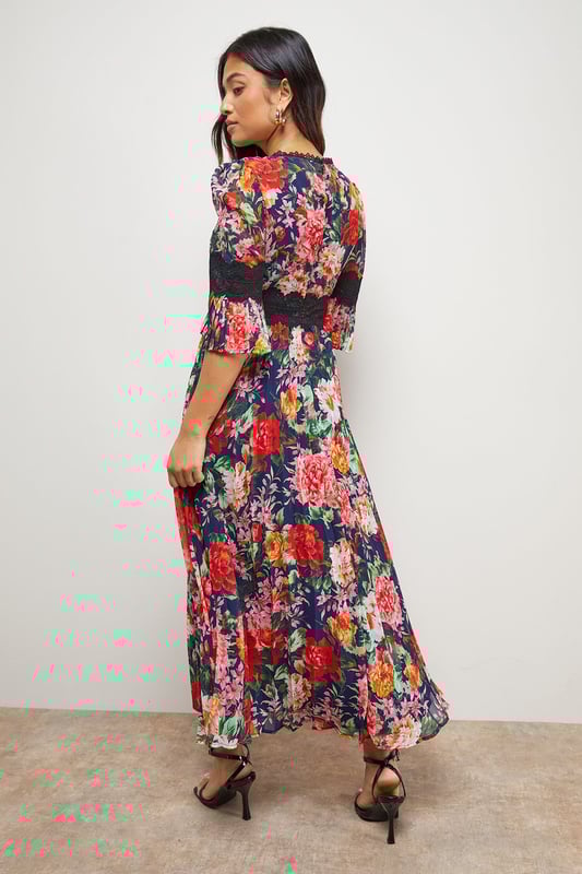Elegant midi dress featuring delicate lace trim detailing across the bodice
        Feminine pleated skirt creates beautiful movement and dimension
        Flattering crew neckline complemented by charming three-quarter length sleeves
        Designed specifically for petite frames with a perfectly proportioned midi length
        Striking printed pattern throughout adds visual interest and contemporary appeal
    
    This enchanting Oasis midi dress combines classic femininity with modern design elements. The intricate lace trim adds a touch of romance to the bodice, whilst the pleated skirt creates a graceful silhouette that moves beautifully with every step. Perfect for special occasions, this dress can be styled with strappy heels and a clutch bag for weddings or formal events. The versatile design also transitions wonderfully to garden parties or race day events when paired with a fascinator and elegant jewellery. The three-quarter length sleeves offer just the right amount of coverage, making this piece suitable for various seasons. For cooler evenings, layer with a tailored blazer or delicate wrap to maintain the dress's refined aesthetic whilst staying comfortable throughout your event.
