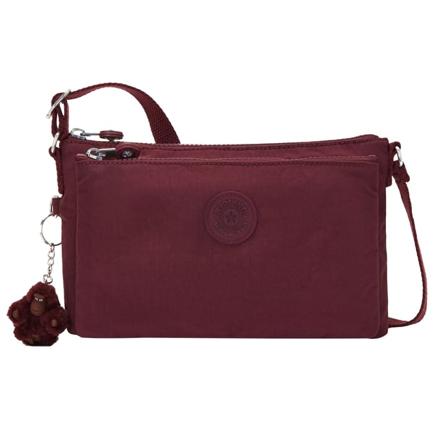 The Kipling Mikaela Women's Merlot Crossbody Bag combines chic style with practicality, perfect for women who want a functional yet fashionable accessory for everyday use. With its rich merlot color and compact design, this bag is a versatile choice for both casual and dressy occasions.
Key features:
Elegant Crossbody Design: 

The compact and sleek crossbody design offers hands-free convenience, making it ideal for daily use or special outings. The adjustable strap allows for a personalized fit, so you can wear it comfortably across your body or on your shoulder.

Premium Nylon Fabric:

Made from Kipling’s signature, lightweight, and water-resistant nylon material, this bag is durable, easy to maintain, and ideal for everyday wear. It resists wear and tear, ensuring long-lasting performance.

Spacious and Organized Interior: 

Despite its small size, the Mikaela crossbody offers a well-organized interior with multiple compartments to keep your essentials neatly arranged. The main compartment and additional pockets provide enough space for your phone, wallet, keys, makeup, and other small items.

Chic Merlot Color: 

The deep, rich merlot color adds a sophisticated and stylish touch to the bag, making it a versatile accessory that can easily pair with both casual and evening outfits.

Kipling Monkey Keychain: 

Like many Kipling bags, the Mikaela features the signature Kipling monkey keychain, adding a playful and recognizable touch to the design.

Zippered Closure: 

The bag’s main compartment is secured with a zipper, keeping your belongings safe and secure while you’re on the go.

Lightweight and Comfortable: 

The lightweight design ensures comfort throughout the day, and the adjustable strap allows for easy customization of the fit, making it ideal for all-day wear.

The Kipling Mikaela Women's Merlot Crossbody Bag is the perfect combination of style, functionality, and comfort. Whether you're heading to work, enjoying a day out, or attending a casual evening event, this crossbody bag offers a practical, stylish way to carry your essentials.