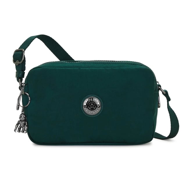 The Kipling Milda Women's Green Crossbody Bag is a functional and stylish accessory that is perfect for everyday use. With its compact size and vibrant green color, this crossbody bag offers a modern, casual look while providing ample space to carry your essentials.
Key features:
Compact Crossbody Design: 

The Milda features a medium-sized crossbody design, offering a perfect balance between being small enough to carry comfortably and large enough to store your essentials like a phone, wallet, keys, and makeup.

Durable Nylon Fabric: 

Made with Kipling's signature lightweight, water-resistant nylon, this bag is both durable and easy to clean. The fabric ensures long-lasting use while maintaining its quality and appearance over time.

Adjustable Crossbody Strap: 

The adjustable shoulder strap allows for a customizable fit, providing comfortable wear throughout the day. You can easily adjust the length for crossbody or shoulder wear, making it a versatile option.

Vibrant Green Color: 

The bold green color adds a fun and fresh touch to your wardrobe, making this bag a standout piece. It complements both casual and more polished outfits, perfect for a wide range of occasions.

Kipling Monkey Keychain: 

The iconic Kipling monkey keychain adds a playful touch to the design, giving the bag a distinctive look that is both functional and fun.

Zippered Main Compartment: 

The main compartment is secured with a zipper, ensuring your belongings stay safe and secure as you go about your day.

Functional Interior: 

The bag features a well-organized interior with zippered pockets and slip compartments to help you keep everything organized and easily accessible.

The Kipling Milda Women's Green Crossbody Bag is a great choice for women looking for a practical, stylish, and fun accessory. Whether you're heading to work, running errands, or enjoying a casual day out, this crossbody bag offers the perfect combination of style, organization, and comfort.