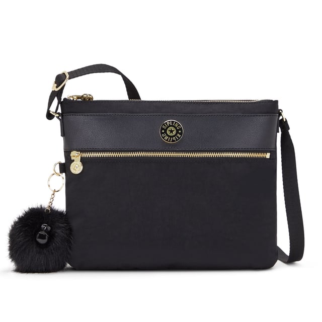 The Kipling Ambrosia Women's Black Crossbody Bag is a chic and functional accessory designed for women who value both style and practicality. This versatile crossbody bag is perfect for everyday use, offering ample storage while maintaining a sleek and minimalist design.
Key features:
Sleek Crossbody Design: 

The Ambrosia features a compact and stylish crossbody design, making it ideal for hands-free convenience. The adjustable strap allows you to wear it comfortably across your body or over your shoulder.

Durable Nylon Fabric: 

Made from Kipling’s signature, lightweight, and water-resistant nylon, this bag is durable, easy to clean, and built to withstand daily wear and tear. The fabric ensures your bag remains in great condition for long-term use.

Organized Interior: 

The Ambrosia offers a well-organized interior with multiple compartments, including zippered and slip pockets, to keep your essentials such as your phone, wallet, keys, and makeup neatly arranged and easy to access.

Timeless Black Color: 

The black color of this bag adds a sophisticated touch, making it a versatile accessory that pairs well with almost any outfit. Whether for work, travel, or casual outings, this classic color ensures it complements a variety of looks.

Kipling Monkey Keychain: 

Like many Kipling bags, the Ambrosia features the iconic Kipling monkey keychain, adding a playful and recognizable detail to the design.

Zippered Closure: 

The main compartment of the bag is secured with a zipper, ensuring that your belongings stay safe and secure while you're on the move.

Lightweight and Comfortable: 

The lightweight construction of the bag ensures it is comfortable to carry, even for extended periods. The adjustable crossbody strap provides a customizable fit for added convenience.

The Kipling Ambrosia Women's Black Crossbody Bag is the ideal choice for women seeking a versatile, stylish, and functional bag. Whether you're running errands, going to work, or enjoying a day out, this crossbody bag offers the perfect combination of practicality and modern design.