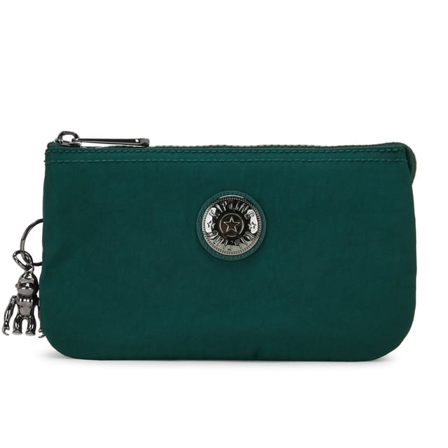 The Kipling Creativity L Women's Green Pouch Bag is a versatile and functional accessory designed to keep your essentials organized while adding a pop of color to your look. With its compact size and stylish green hue, this pouch bag is perfect for daily use, travel, or as a smaller option to carry in a larger bag.
Key features:
Compact and Versatile Design: 

The Creativity L is a small, zippered pouch that can be used on its own or as an organizer within a larger bag. It’s perfect for holding essentials like your phone, keys, makeup, or coins, and can easily fit into a handbag, backpack, or travel bag.

Durable Nylon Fabric: 

Made from Kipling’s signature lightweight, water-resistant nylon material, this pouch is durable, easy to clean, and resistant to wear. It’s built to stand up to everyday use while keeping your items protected.

Bold Green Color: 

The vibrant green color adds a refreshing touch to your accessories, making it a fun and stylish way to carry your essentials. It pairs well with both casual and more sophisticated looks.

Kipling Monkey Keychain: 

The signature Kipling monkey keychain adds a playful, recognizable touch to the pouch, giving it a fun and distinctive look.

Secure Zippered Closure: 

The pouch features a secure zipper closure, ensuring your items stay safe and protected while you’re on the move.

Lightweight and Portable: 

The Creativity L is lightweight and easy to carry, making it perfect for when you need a compact, practical bag to store your essentials.

Multi-functional Use: 

Whether used as a standalone pouch, a makeup bag, a travel accessory, or as part of a larger bag organization system, the Creativity L offers great versatility for various needs.

The Kipling Creativity L Women's Green Pouch Bag is a great choice for those looking for a compact, stylish, and functional way to keep their essentials organized. Its lightweight design, secure closure, and playful color make it a practical accessory for everyday use or as a fun addition to your travel gear.