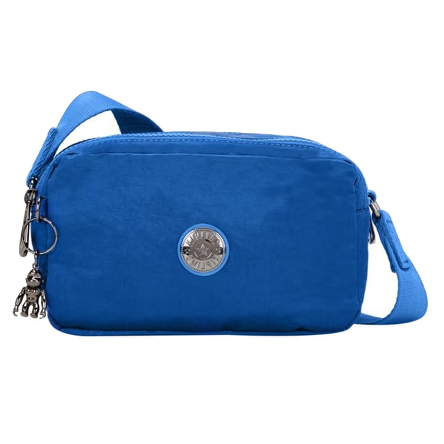 The Kipling New Milda Women's Blue Crossbody Bag is a sleek, functional, and stylish accessory that offers convenience and comfort for everyday use. Perfect for those who need a practical yet fashionable bag, the New Milda combines functionality with a pop of color.
Key features:
Compact and Stylish Design: 

The compact crossbody bag is designed for easy portability, making it ideal for everyday use, errands, or casual outings. The rich blue color adds a trendy, sophisticated touch that easily complements a variety of outfits.

Durable Nylon Fabric: 

Made with Kipling’s signature lightweight, water-resistant nylon, the bag is both durable and easy to clean. It’s designed to withstand daily wear and tear, ensuring long-lasting use.

Multiple Compartments: 

The bag features a well-organized main compartment and several smaller zippered pockets, offering ample space for your essentials like phone, wallet, keys, and makeup. The interior is designed to keep everything neatly arranged and easily accessible.

Adjustable Crossbody Strap: 

The adjustable shoulder strap allows for a customized fit, making it easy to wear across your body or over your shoulder for hands-free convenience.

Kipling Monkey Keychain: 

The signature Kipling monkey keychain adds a playful, fun detail to the bag, making it instantly recognizable and giving it a quirky, lighthearted charm.

Zippered Closure: 

The bag features a secure zippered closure to ensure your belongings stay safe and protected while you’re on the move.

Lightweight and Comfortable:

The bag is lightweight, providing all-day comfort without weighing you down. Whether you’re running errands or traveling, it offers the perfect combination of style and practicality.

The Kipling New Milda Women's Blue Crossbody Bag is the perfect blend of practicality, style, and durability. Ideal for women on the go, this bag will help keep your essentials organized and easily accessible while adding a touch of fun and personality to your look.