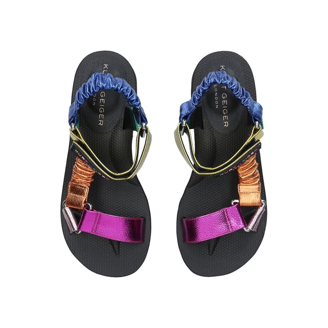 The Orion sandal is a open style with multi-colour ruched straps across the foot. The velcro strap is topped with rubber branded patch. Sole height: 4cm. Black treaded sole.