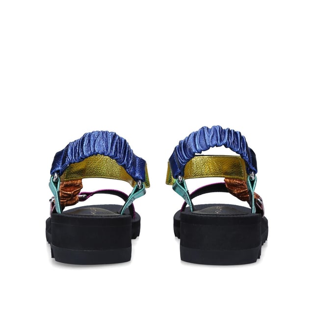 The Orion sandal is a open style with multi-colour ruched straps across the foot. The velcro strap is topped with rubber branded patch. Sole height: 4cm. Black treaded sole.