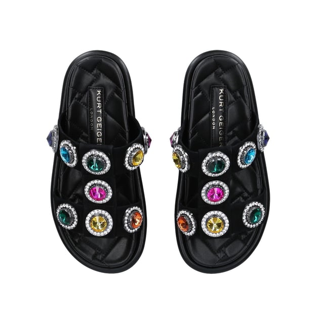 The Orson Crystal Sandal arrives in a black suede. The strap is topped with oversized multi-colour crystals. Overstitched quilted insole with padding, seen across the collections.
