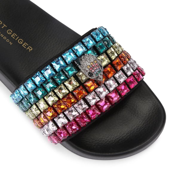 This Carvela Meena Eagle sandal slips onto the foot with a black moulded footbed. The toe strap is designed in the rainbow Kensington weave with Kurt Geiger London branding on a crystal coated canvas. There is an antiqued silver eagle head sat on top.