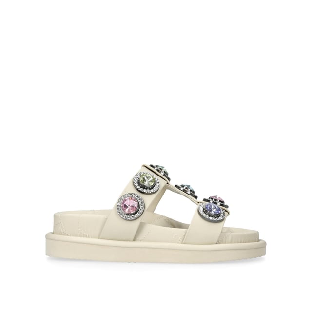 The Orson Crystal Sandal arrives in a sleek bone. The strap is topped with oversized multi-colour crystals. Overstitched quilted insole with padding, seen across the collections.