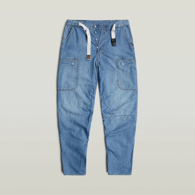 G-Star RAW Travail 3D Relaxed Jeans Integrated belt with buckle. Inset pockets- coin pocket. Reinforced patch pockets front and back- Velcro closure. Button closure. Low waist. Jean Travail 3D is designed in a relaxed, loose fit. Patched pockets are added to the front and back, offering a Velcro closure. Use the integrated belt to style it as you like it. 100% Cotton. 2x1 right hand twill. Lighter weight 8 oz denim. Straight