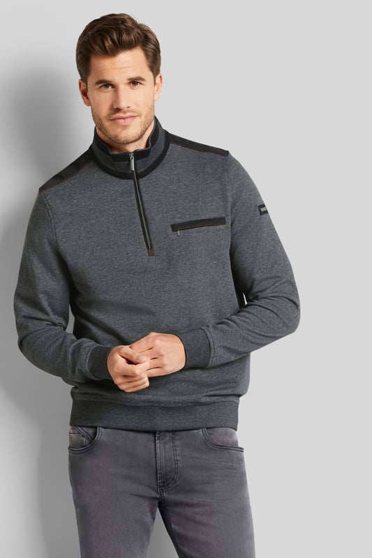 De sweat troyer is gemaakt van een kleine veelkleurige structuur. Hij kan worden gedragen met de rits dicht als een moderne opstaande kraag, maar de troyer slaat ook een mooi figuur met de rits open. De katoen-elastaanmix maakt het kledingstuk bijzonder comfortabel en biedt veel bewegingsvrijheid.