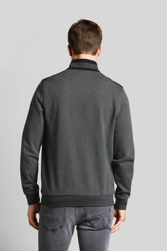 De sweat troyer is gemaakt van een kleine veelkleurige structuur. Hij kan worden gedragen met de rits dicht als een moderne opstaande kraag, maar de troyer slaat ook een mooi figuur met de rits open. De katoen-elastaanmix maakt het kledingstuk bijzonder comfortabel en biedt veel bewegingsvrijheid.