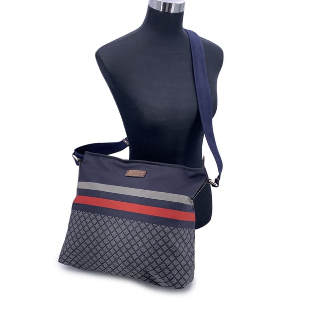 VINTAGE, RRP AS NEW
A nod to sporty sophistication with unmistakable Gucci flair, the Diamond Messenger Shoulder Bag is a standout piece from the Italian house's contemporary era. Unisex model, the bag is crafted from durable printed blue nylon, and combines utilitarian function with signature heritage Condition Rating: B - VERY GOOD CONDITIONCondition Details: Gently used. Some normal wear of use on bottom corners. Some light scratches on brown leather trim. Please check the images carefully. Please ask if you need to know more details or if you have any doubts.Measurements (cm):Depth: 12.7Height: 29.2Length: 35.6Other Details: Dustbag? NoKeys? NoBox? No Measurments:  width: 127 mm length: 356 mm height: 292 mm strap length: 0 mm handle drop: 0 mm