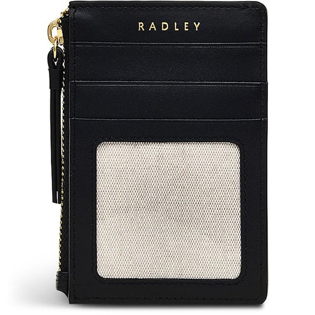 Bolso acolchado negro para mujer de Radley, fabricado con cuero. Presenta: perro scottie acolchado, cierre de cremallera, tres ranuras para tarjetas, tirador de cremallera de cuero y medidas de 12 cm de ancho x 8 cm de alto.