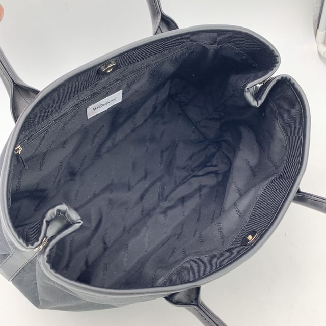 VINTAGE, RRP AS NEW
Understated, refined, and undeniably rare, this Vintage Yves Saint Laurent Pour Homme tote captures the quiet confidence of YSL's menswear line in a form that still feels effortlessly modern. Crafted from durable black nylon canvas and accented with sleek black leather trim, this tote is a functional piece with subtle designer distinction.  At the front, a silver metal Yves Saint Laurent tab adds a discreet touch of luxury, while the magnetic button closure opens to reveal a black nylon canvas lining-clean, simple, and timeless. Inside, a zip pocket offers secure storage, and the original 'Yves Saint Laurent' tag affirms the bag's ity. A true collector's bonus: the 'Yves Saint Laurent Pour Homme' shop hang tag remains thoughtfully attached, hinting at the bag's pristine and possibly unused Condition Rating: A - EXCELLENTCondition Details: Gently used. Yves Saint Laurent hang tag still attached. Please check the photos carefully and ask if you need to know more details or if you have any doubts.Measurements (cm):Depth: 15.2Height: 24.1Length: 35.6Other Details: Dustbag? NoKeys? NoBox? No Measurments:  width: 152 mm length: 356 mm height: 241 mm strap length: 0 mm handle drop: 0 mm