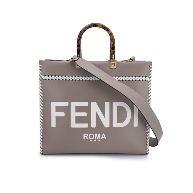 VINTAGE, RRP AS NEW
This beautiful item will come with a Certificate of ity provided by Entrupy. The certificate will be provided at no further cost  Sophisticated and striking, the FENDI Sunshine Medium Shopper Tote in Tortora taupe leather is a modern classic with a nod to vintage elegance. This iconic model blends clean Italian lines with statement-making Condition Rating: A - EXCELLENTCondition Details: Gently used. Minimal creases on leather along the borders. Please check the photos carefully and ask if you need to know more details or if you have any doubts.Measurements (cm):Depth: 15.2Height: 26.7Length: 35.6Other Details: Dustbag? NoKeys? NoBox? No Measurments:  width: 152 mm length: 356 mm height: 267 mm strap length: 0 mm handle drop: 0 mm